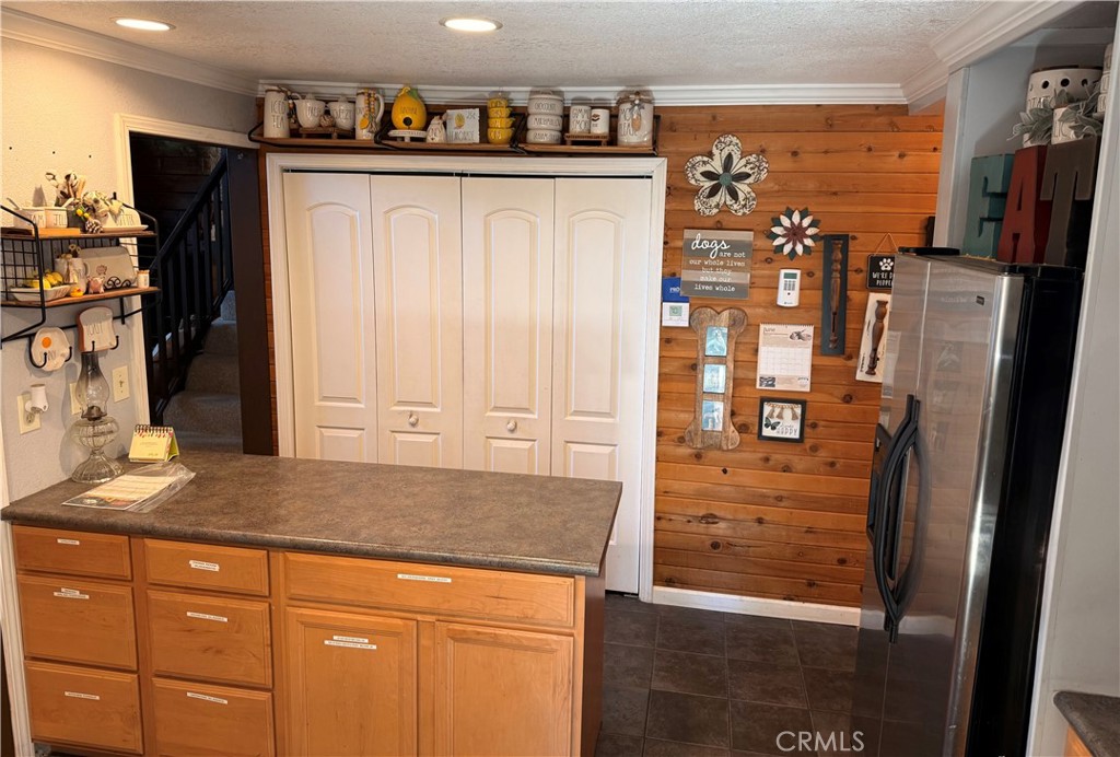 9312 Mountain Meadow Road Shingletown, CA 96088 - Photo 29 of 44 a kitchen with stainless steel appliances granite countertop a refrigerator and a sink