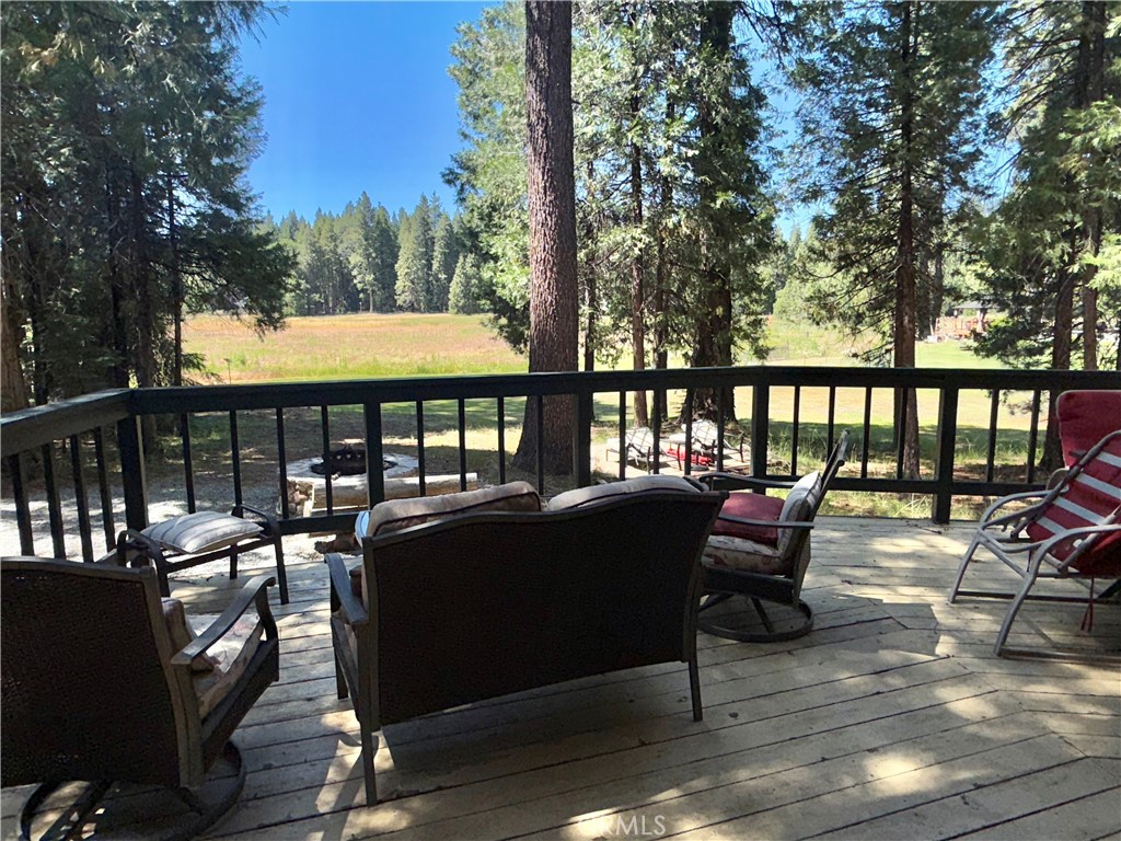 9312 Mountain Meadow Road Shingletown, CA 96088 - Photo 32 of 44 a view of a chairs and tables on the roof deck