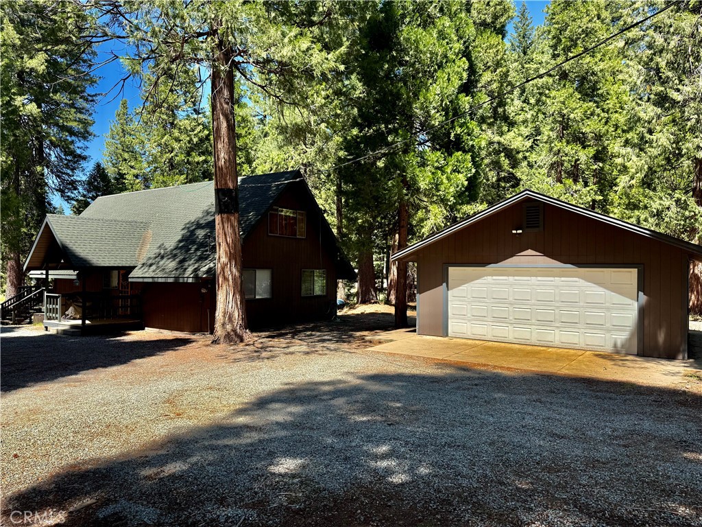 9312 Mountain Meadow Road Shingletown, CA 96088 - Photo 37 of 44 a view of a house with a yard