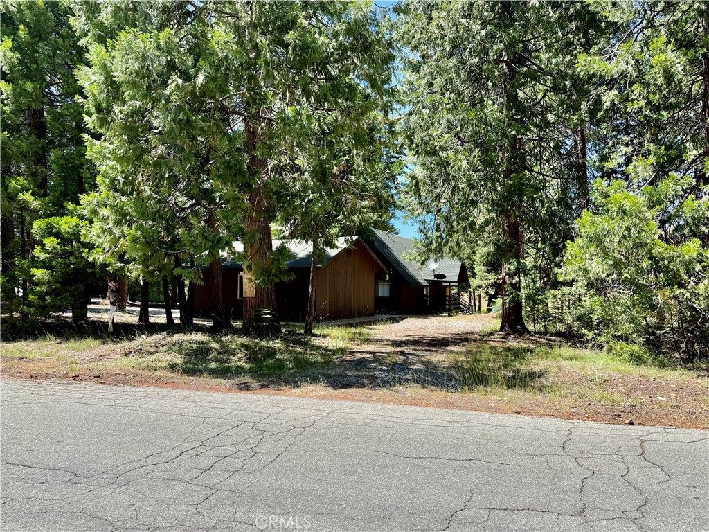 9312 Mountain Meadow Road Shingletown, CA 96088 - Photo 38 of 44 a house with yard in front of it