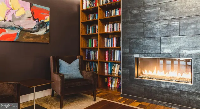 a living room with furniture wooden floor and a table