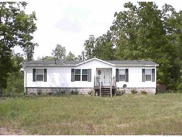 6704 Hair Road Disputanta, VA 23842 - Photo 1 of 1 a front view of a house with garden