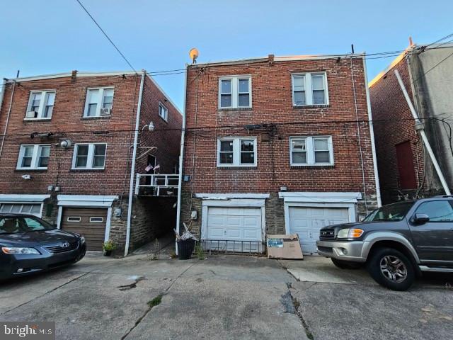 6253 Morton Street Philadelphia, PA 19144 - Photo 17 of 17 a car parked in front of a brick house