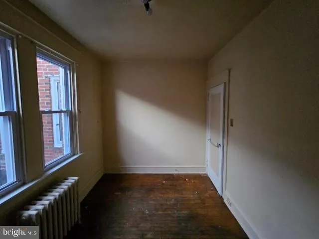 a view of hallway with furniture and a window