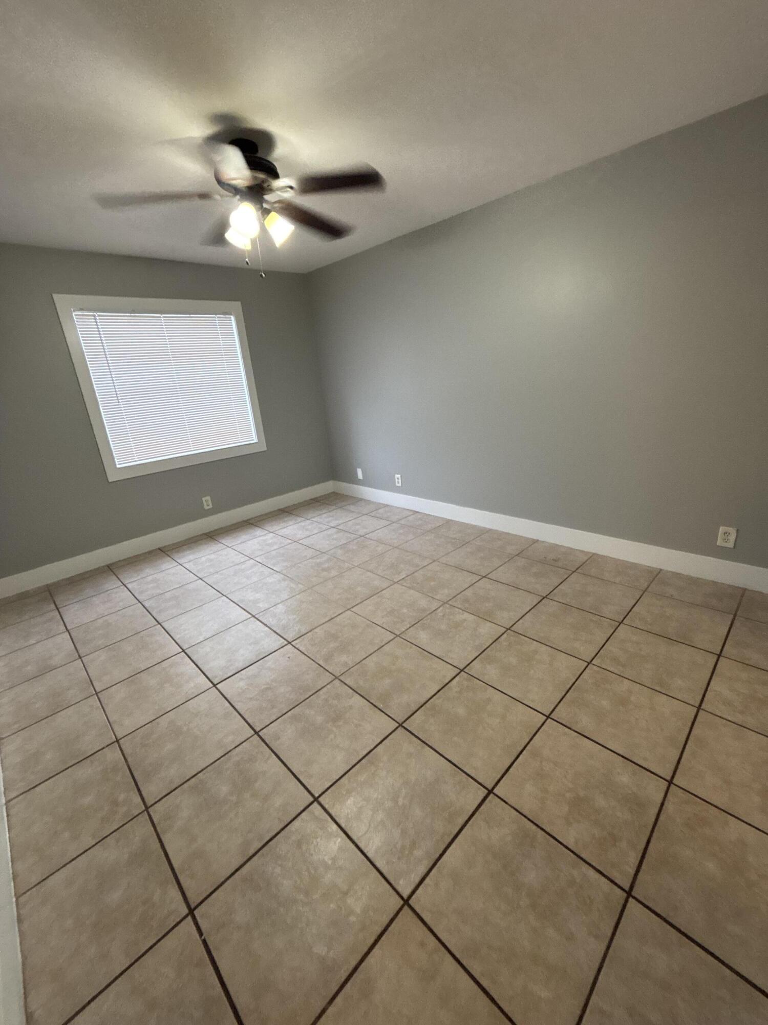 1830 Abbey Road, Unit 105 West Palm Beach, FL 33415 - Photo 10 of 12 a view of an empty room
