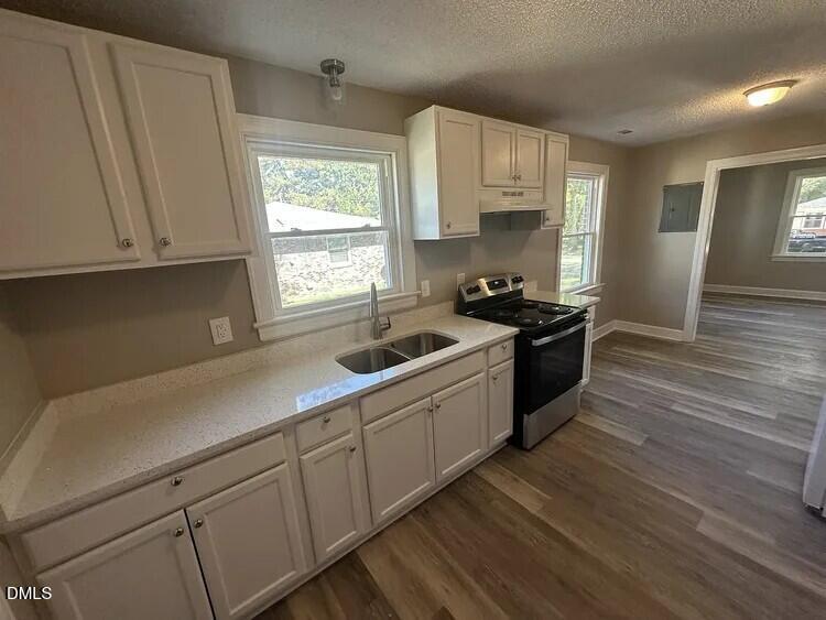 902 Meadow Street South Wilson, NC 27893 - Photo 4 of 10 a kitchen with a sink a window and cabinets