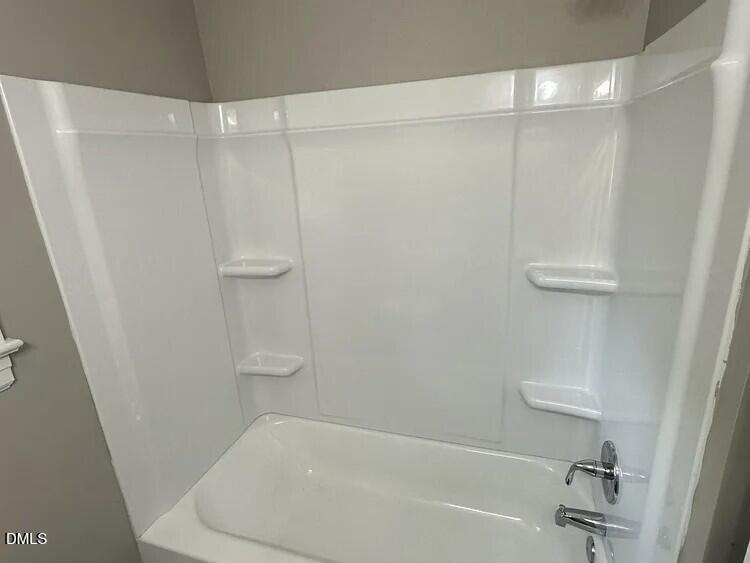 902 Meadow Street South Wilson, NC 27893 - Photo 7 of 10 a bathroom with a shower and a bath tub