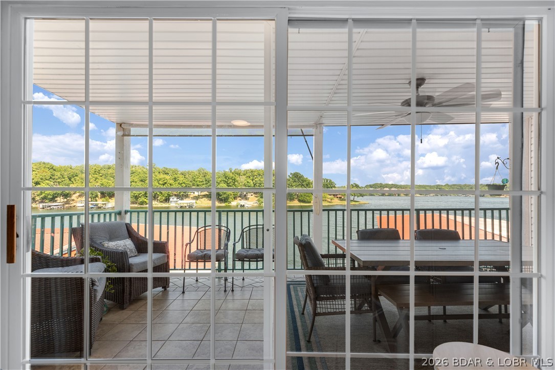 182 Sac Road, Unit C 201 Sunrise Beach, MO 65079 - Photo 12 of 35 Deck Access from Living Room