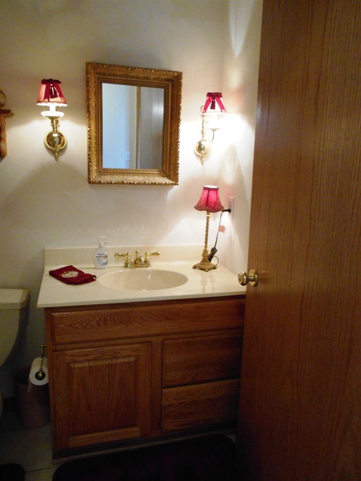 6733 Middle Road South Beloit, IL 61080 - Photo 12 of 19 a bathroom with a sink vanity and a mirror