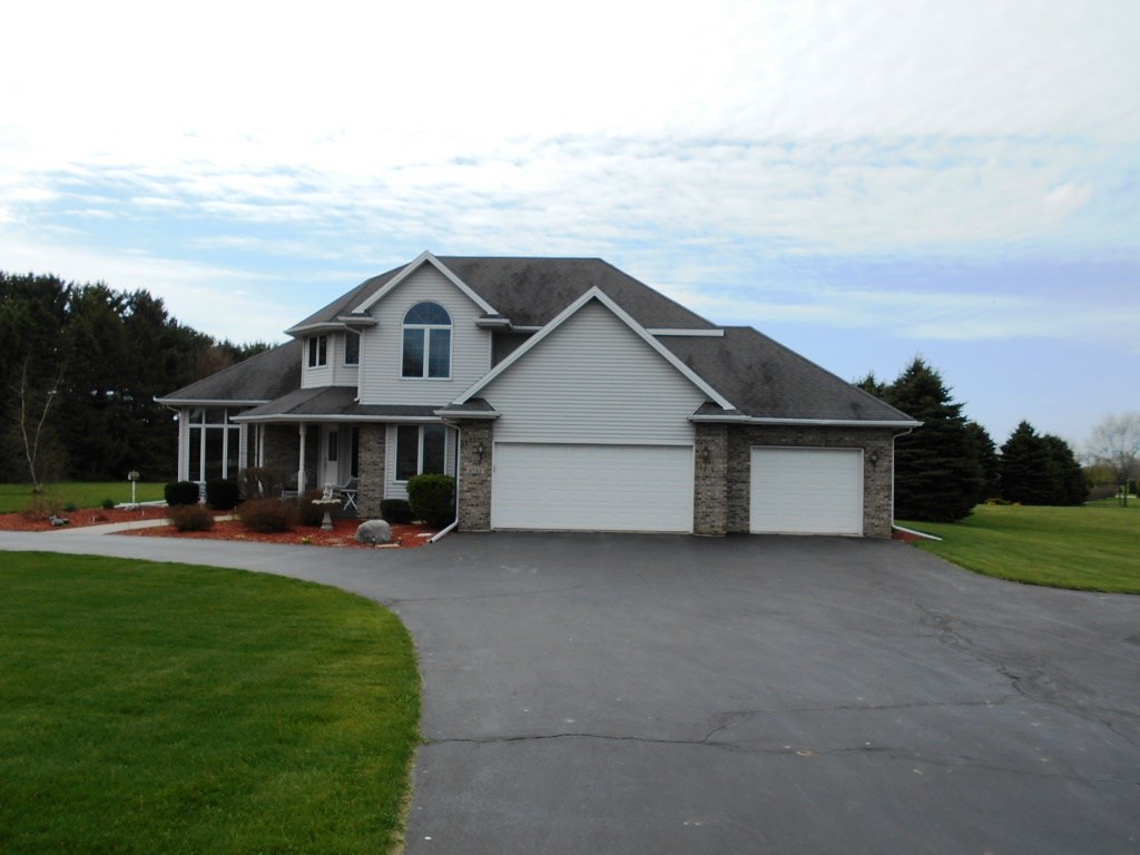 6733 Middle Road South Beloit, IL 61080 - Photo 17 of 19 a front view of a house with patio
