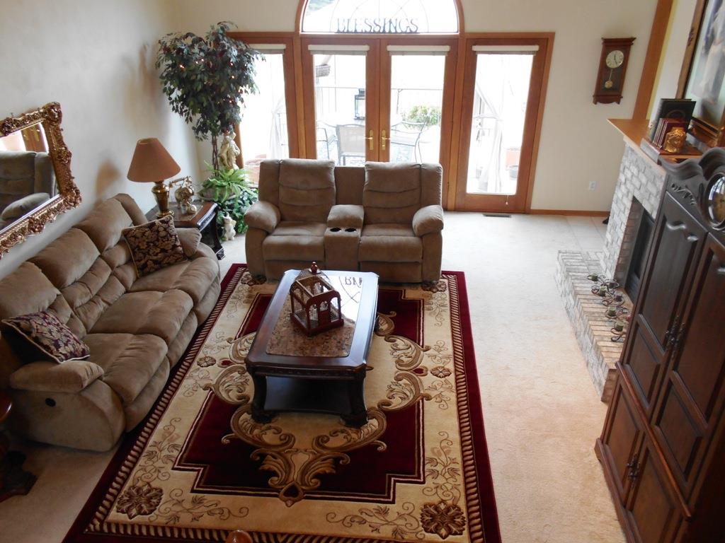 6733 Middle Road South Beloit, IL 61080 - Photo 2 of 19 a living room with furniture and a fireplace