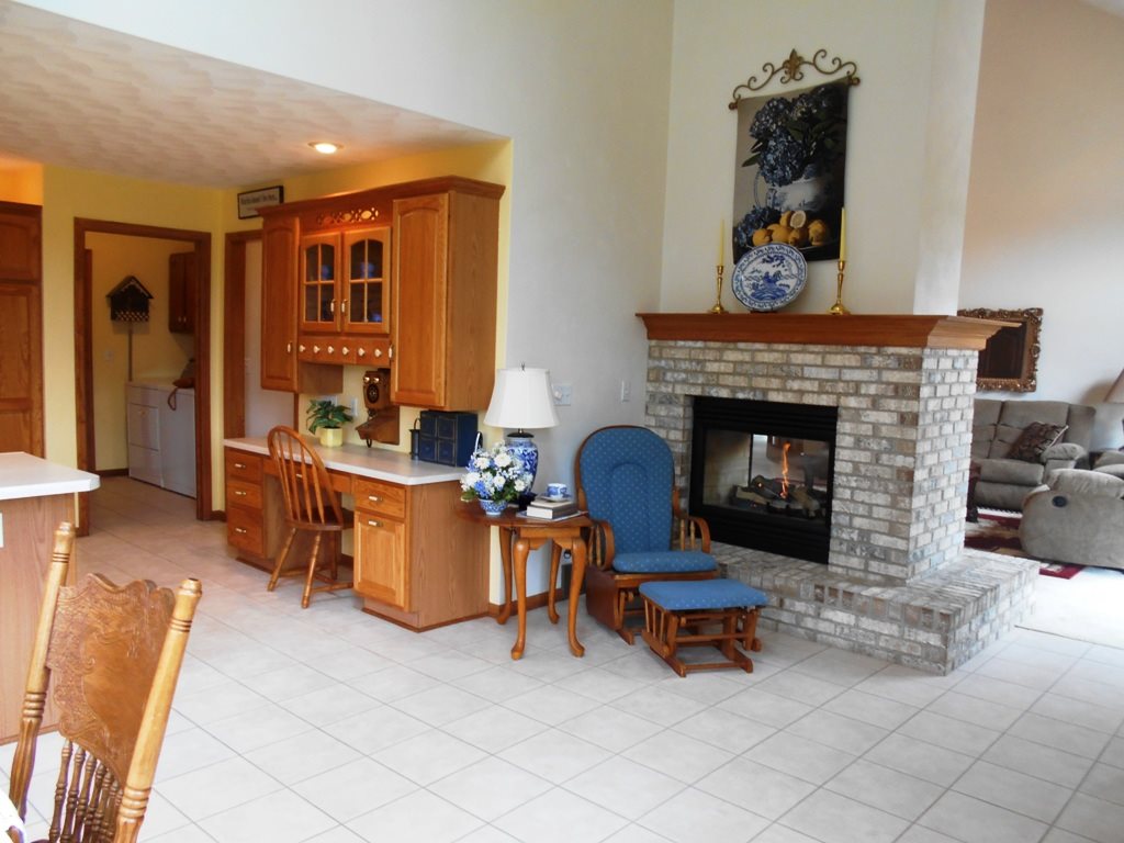 6733 Middle Road South Beloit, IL 61080 - Photo 3 of 19 a living room with furniture and a fireplace