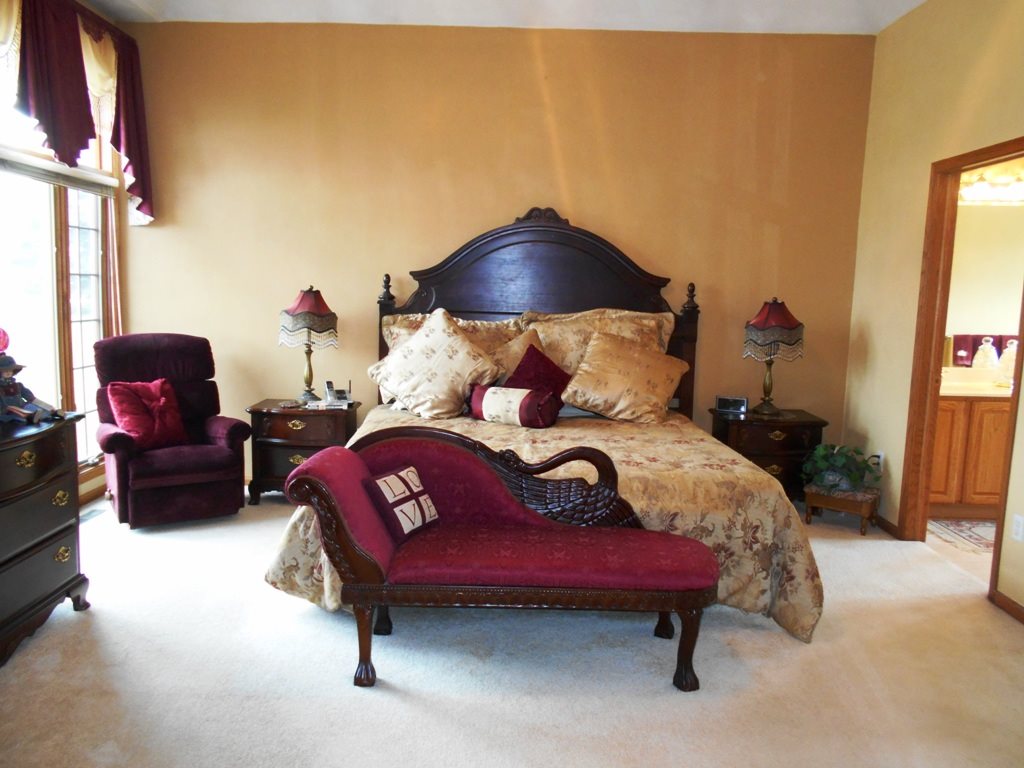6733 Middle Road South Beloit, IL 61080 - Photo 7 of 19 a bedroom with a bed and a chair with the potted plant