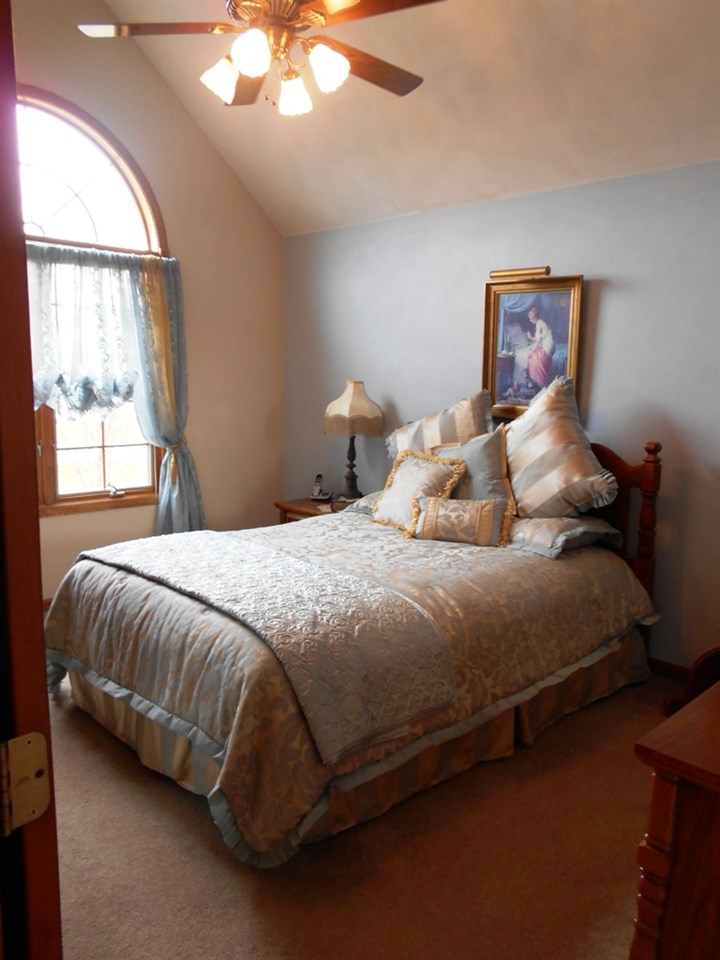 6733 Middle Road South Beloit, IL 61080 - Photo 10 of 19 a bedroom with a bed and window