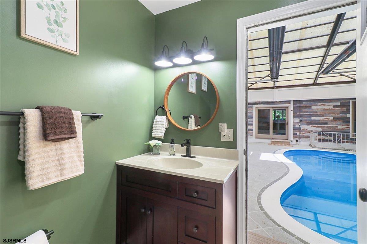 401 Clarkstown Road Mays Landing, NJ 08330 - Photo 13 of 57 a bathroom with a sink and a mirror