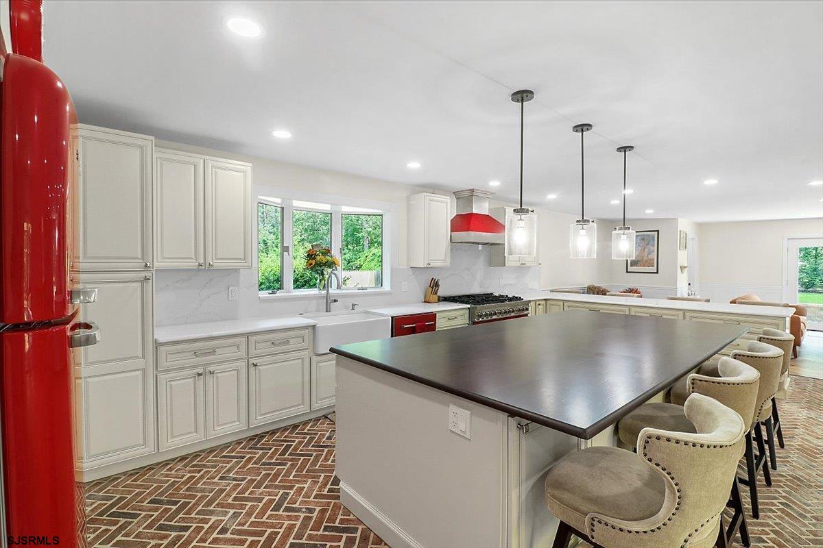 401 Clarkstown Road Mays Landing, NJ 08330 - Photo 17 of 57 a kitchen with granite countertop a sink a window and chairs