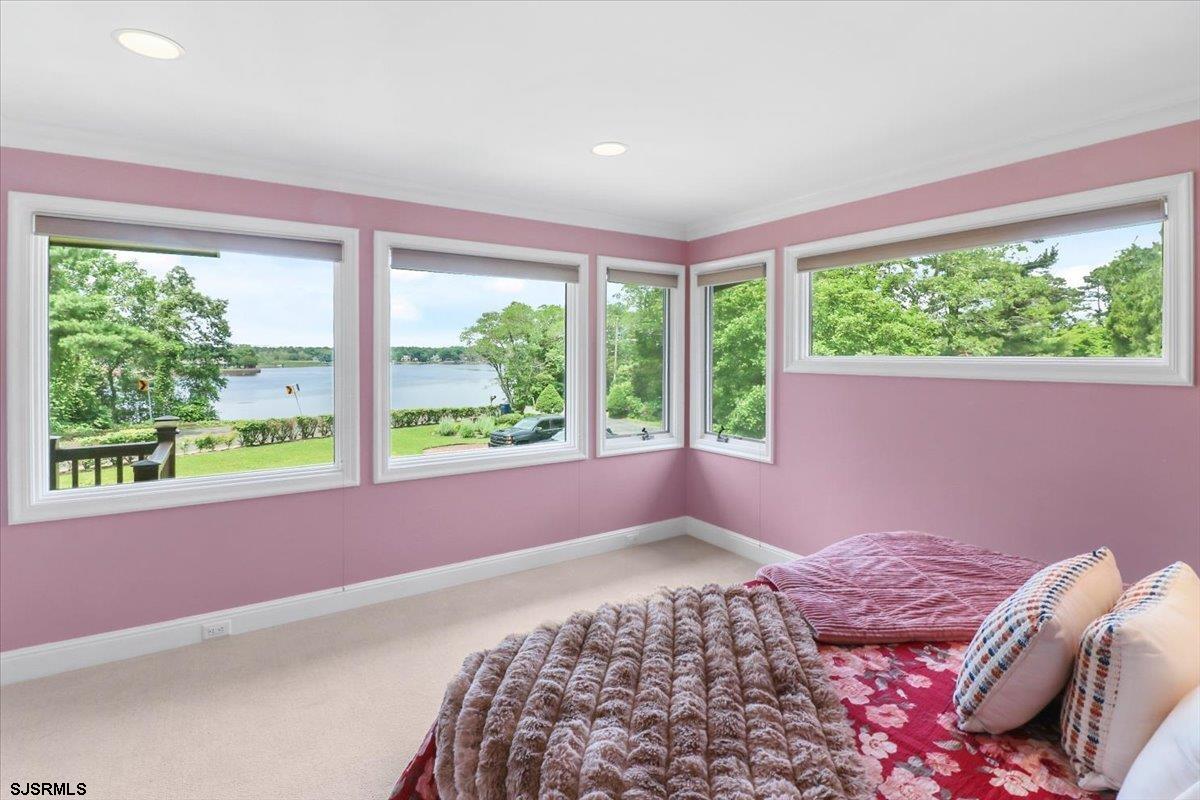 401 Clarkstown Road Mays Landing, NJ 08330 - Photo 18 of 57 a bed sitting in a bedroom next to a window