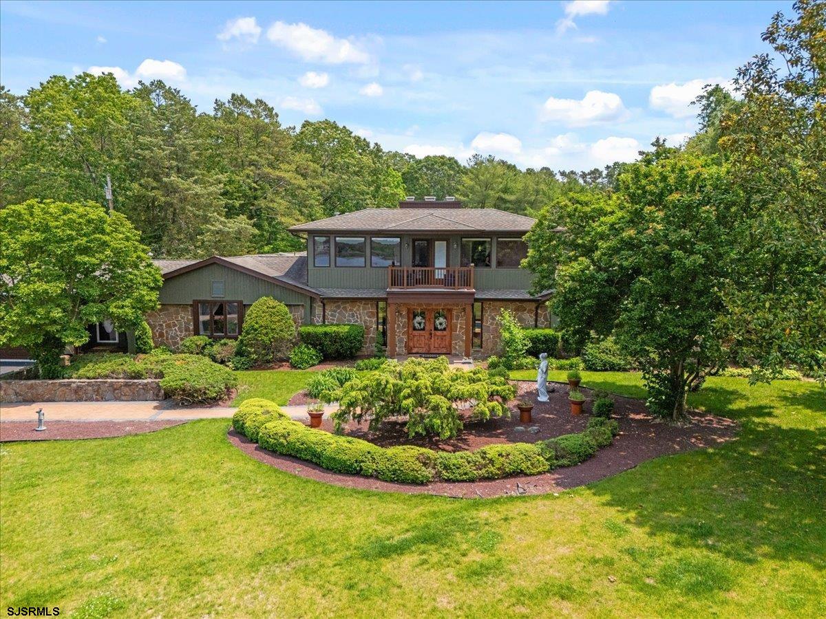 401 Clarkstown Road Mays Landing, NJ 08330 - Photo 24 of 57 a view of a garden with a house in the background