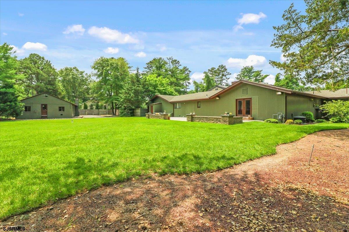 401 Clarkstown Road Mays Landing, NJ 08330 - Photo 28 of 57 a white house with a big yard plants and large trees