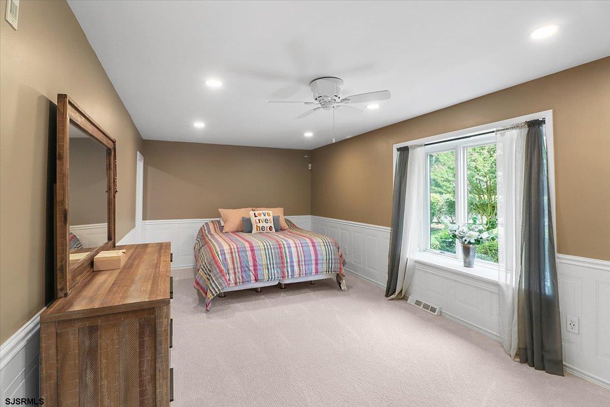 401 Clarkstown Road Mays Landing, NJ 08330 - Photo 30 of 57 a spacious bedroom with a bed and glass window