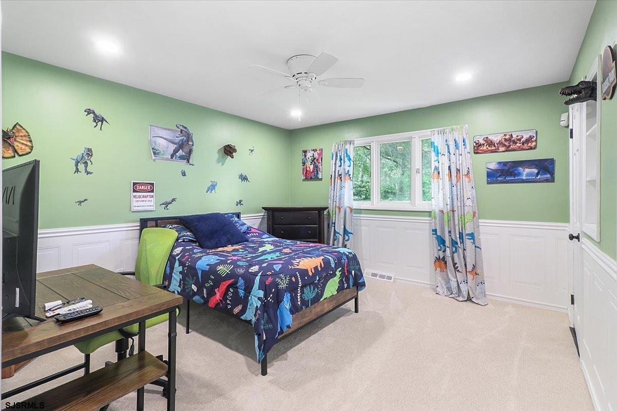 401 Clarkstown Road Mays Landing, NJ 08330 - Photo 31 of 57 a bedroom with a bed and a chandelier