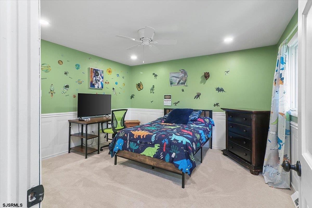 401 Clarkstown Road Mays Landing, NJ 08330 - Photo 32 of 57 a bedroom with a bed and a flat screen tv