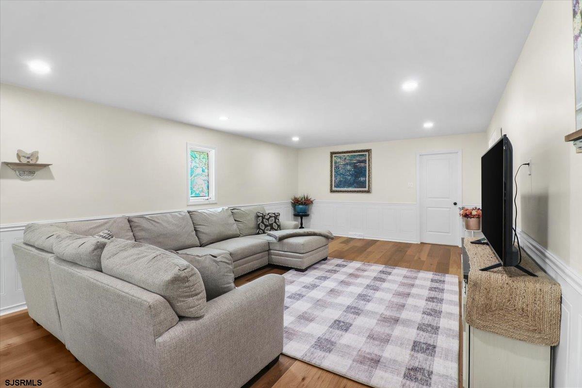 401 Clarkstown Road Mays Landing, NJ 08330 - Photo 39 of 57 a living room with furniture and a flat screen tv