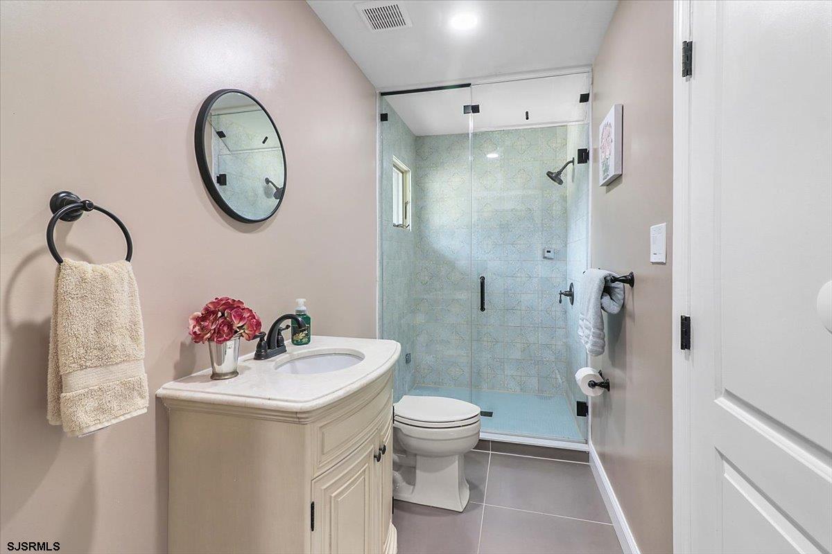 401 Clarkstown Road Mays Landing, NJ 08330 - Photo 52 of 57 a bathroom with a sink mirror toilet and shower