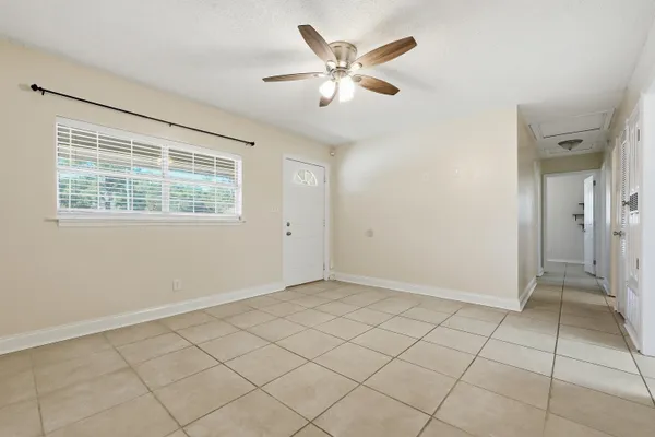 a view of an empty room with a window