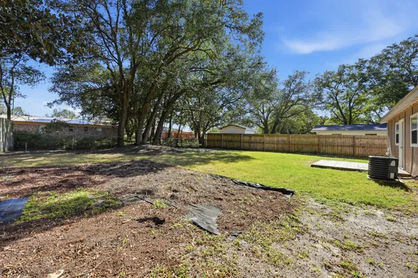 a view of yard with swimming pool and green space