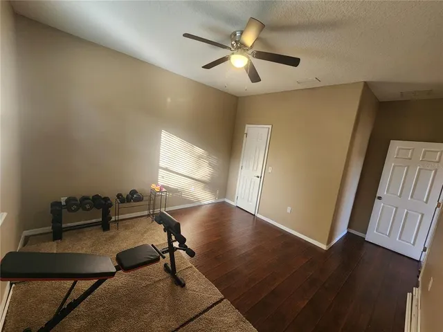 a view of a livingroom with furniture and a window