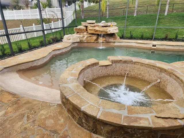 a view of a swimming pool with a sitting space