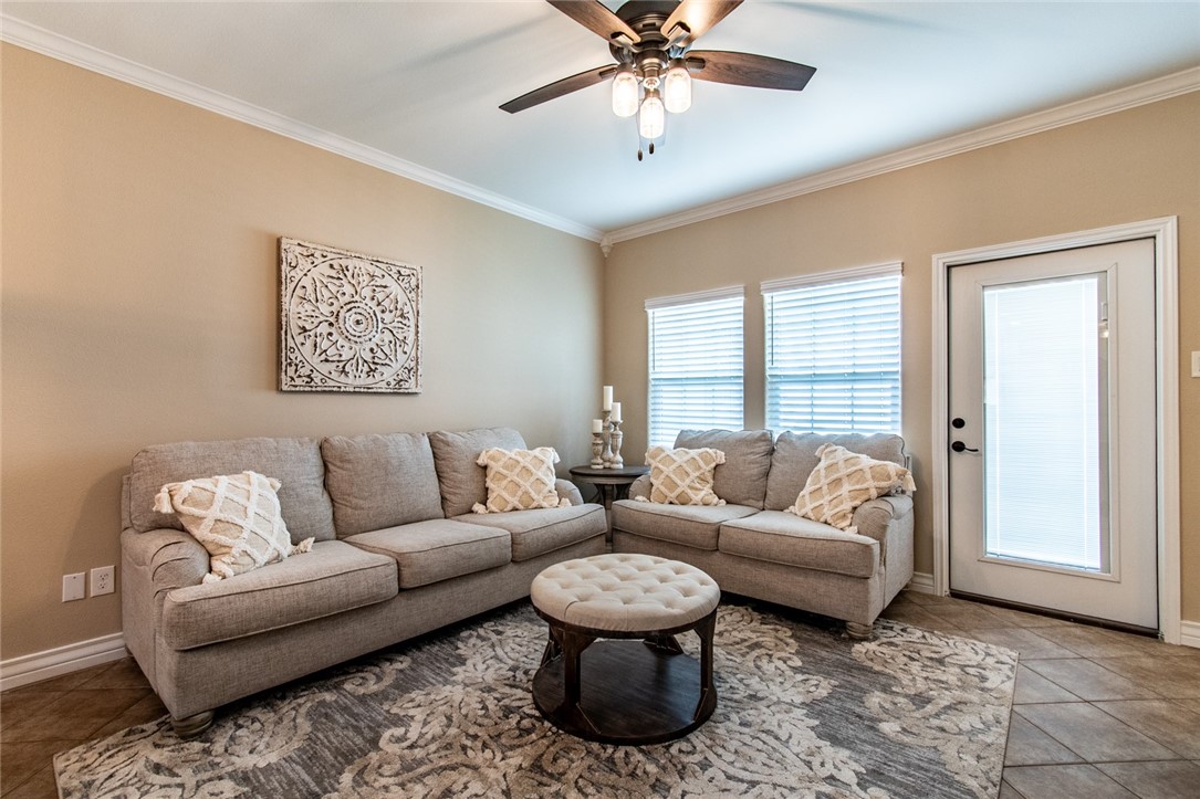 1117 Ninth Street, Unit 803 Port Aransas, TX 78373 - Photo 13 of 27 a living room with furniture and a large window