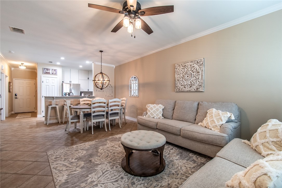 1117 Ninth Street, Unit 803 Port Aransas, TX 78373 - Photo 16 of 27 a living room with furniture and a large window