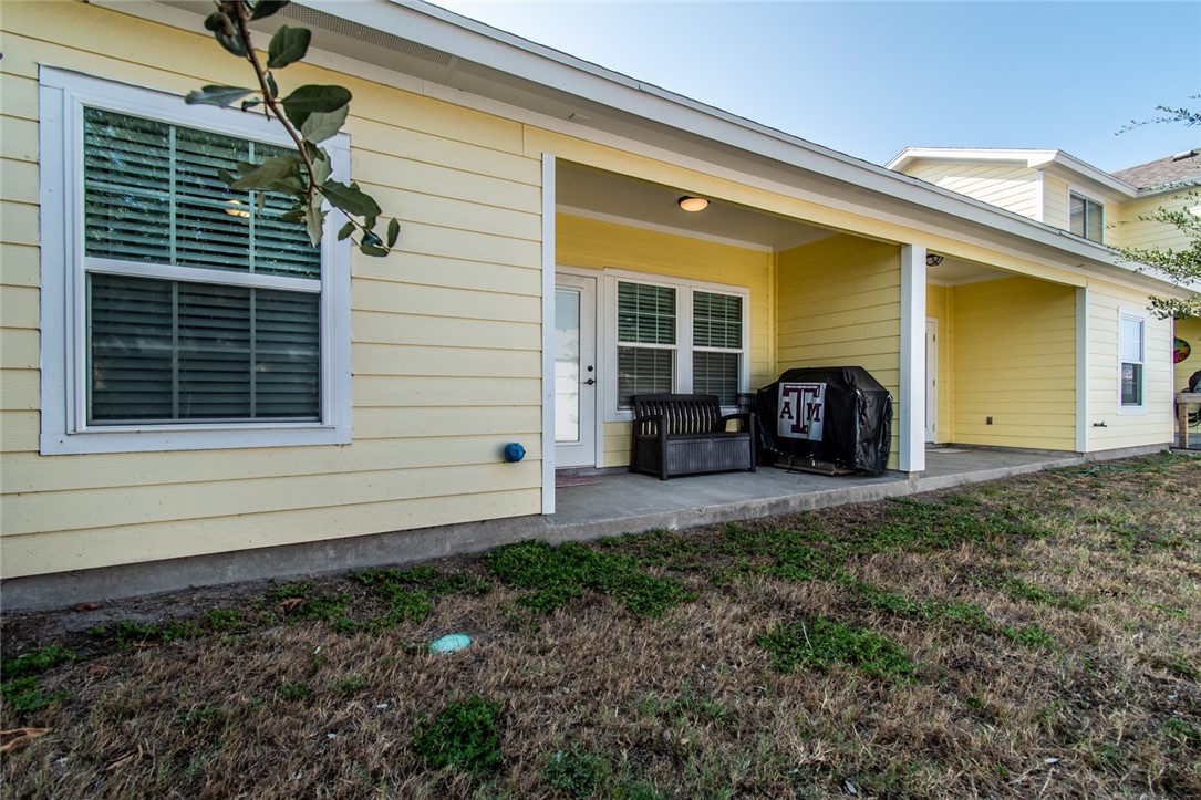 1117 Ninth Street, Unit 803 Port Aransas, TX 78373 - Photo 2 of 27 a view of a house with a back yard