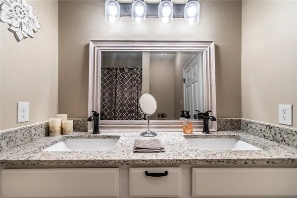 a bathroom with a toilet and a shower curtain