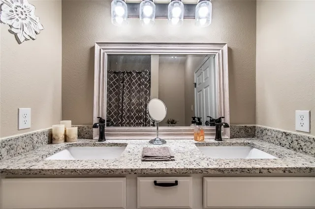 a bathroom with a toilet and a shower curtain