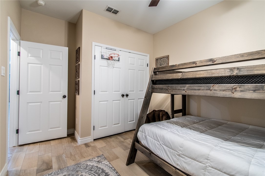 1117 Ninth Street, Unit 803 Port Aransas, TX 78373 - Photo 24 of 27 a bedroom with a bed and a window