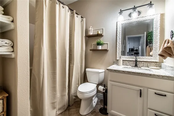 a view of a bathroom with a tub and shower