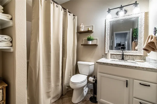 a view of a bathroom with a tub and shower