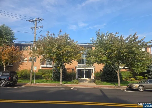 a view of a building with a street