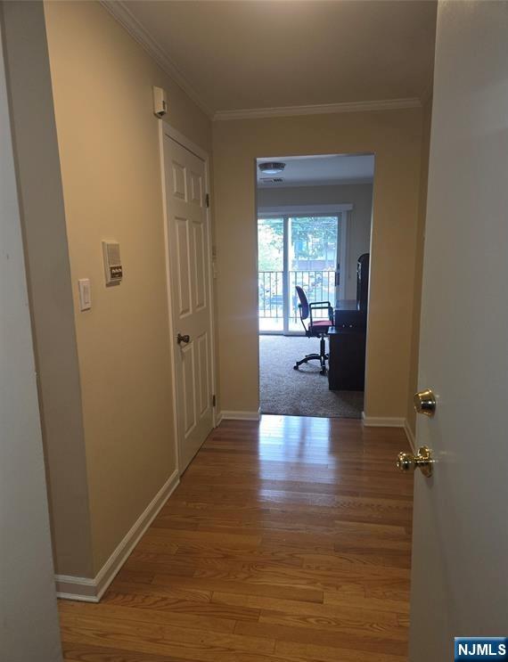 289 Valley Boulevard, Unit 1A Wood-Ridge, NJ 07075 - Photo 12 of 17 a view of a hallway with livingroom wooden floor and windows