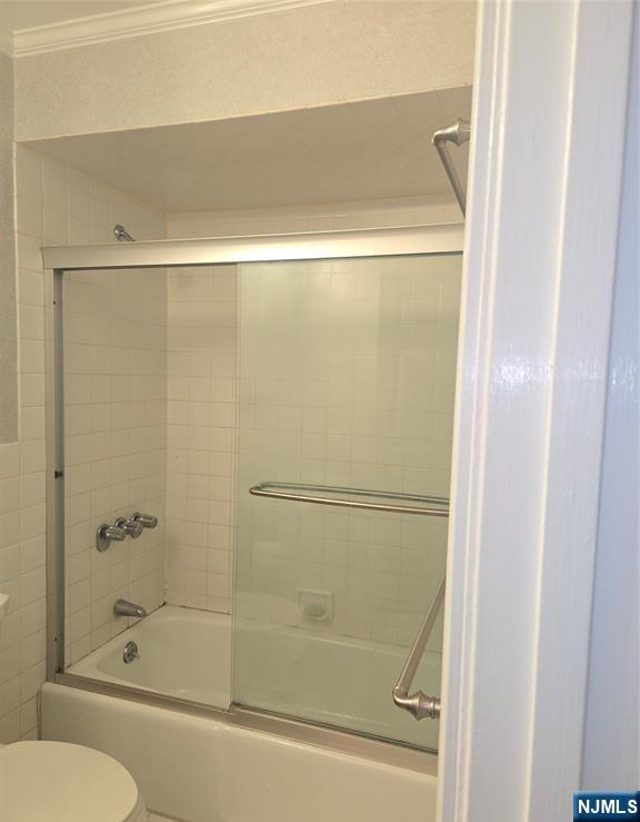 289 Valley Boulevard, Unit 1A Wood-Ridge, NJ 07075 - Photo 15 of 17 a bathroom with a bathtub
