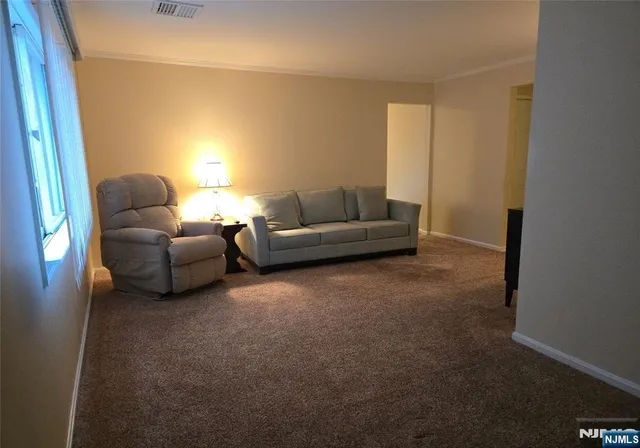 a living room with furniture and a couch