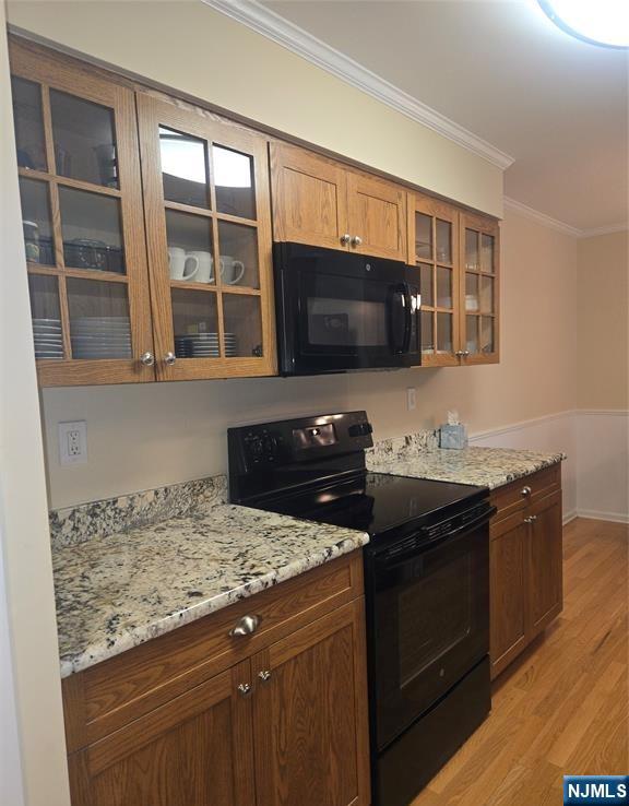 289 Valley Boulevard, Unit 1A Wood-Ridge, NJ 07075 - Photo 10 of 17 a kitchen with granite countertop a stove and a sink