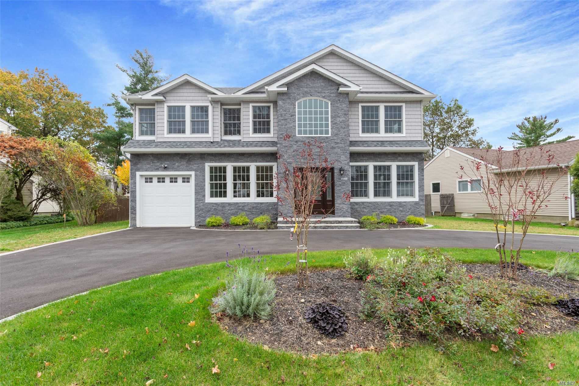 29 Cambria Road Syosset, NY 11791 - Photo 1 of 1 a front view of a house with yard and green space