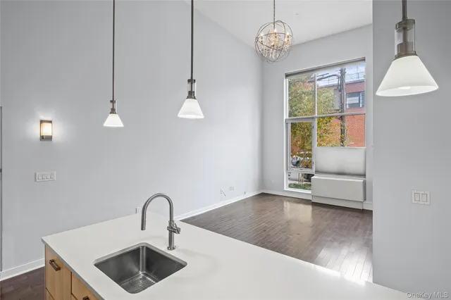 a kitchen with furniture and window