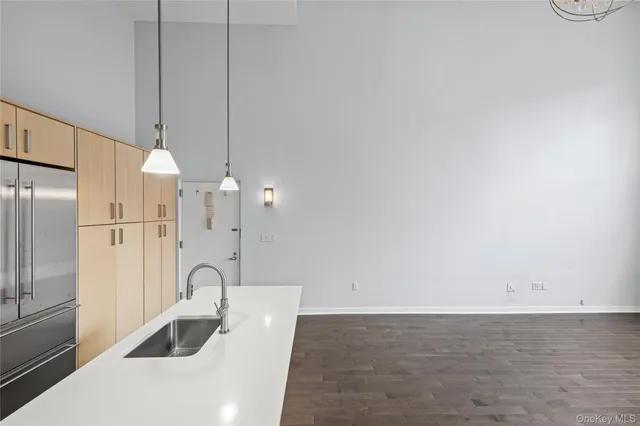 a view of a kitchen with a sink and cabinets