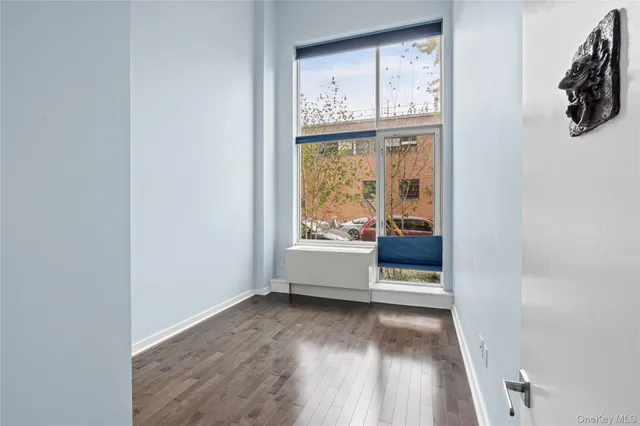 a view of an entryway with wooden floor