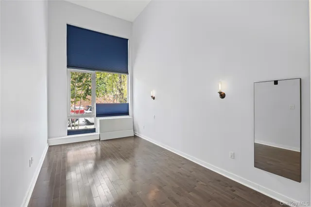 a view of an empty room with glass door